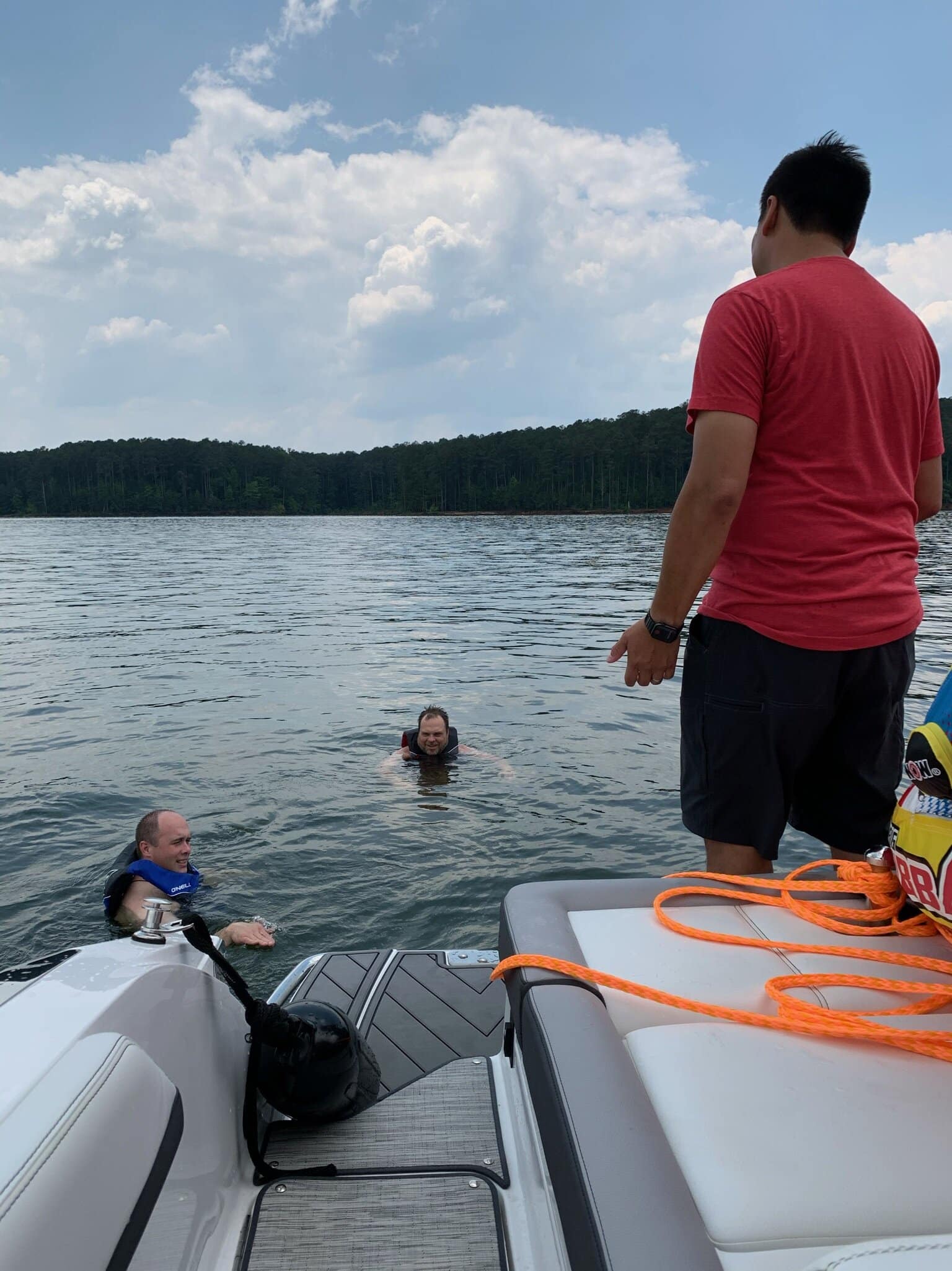 A much smarter Brian Tant (wet on the left) and Brad Herring (wet on the right). Mark Puckett (dry on the boat).